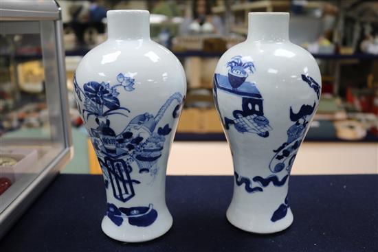 A pair of Chinese blue and white vases, wood stands